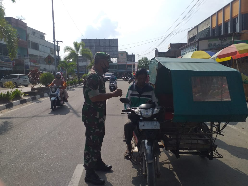 Serma RP Sianipar Melaksanakan Giat Sosialisasi Pencegahan Covid-19